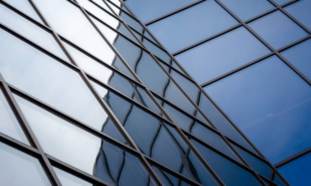 istock reflection with distortion in the window of a modern tall building 2189152667