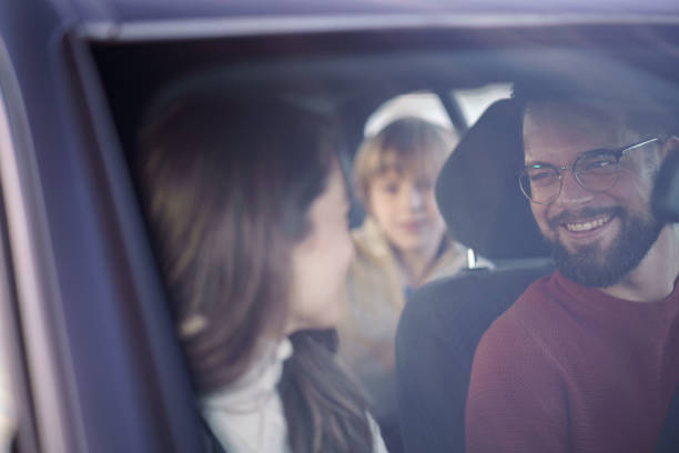 istock A man and a woman are talking while sitting in a car with their son 2189153745