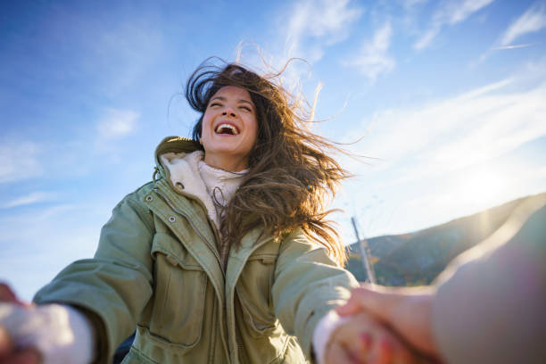 istock A woman spins with her partner on a winter day outside 2189153973