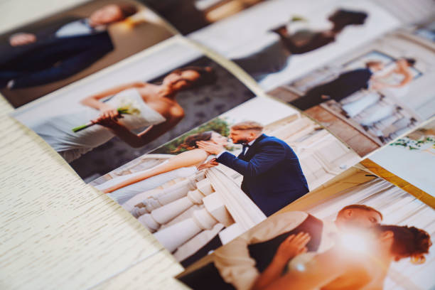 istock Printed wedding photos laid out on a wooden surface. 2189155605