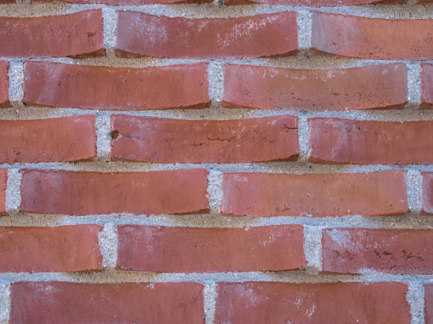 istock A textured red brick wall with staggered rows and visible gray mortar 2189155813