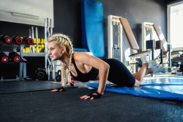 istock Young athletic woman doing female push-ups. 2189157019