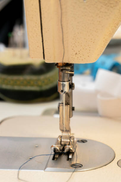 istock Sewing machine close-up revealing detailed needle and presser foot 2189158200