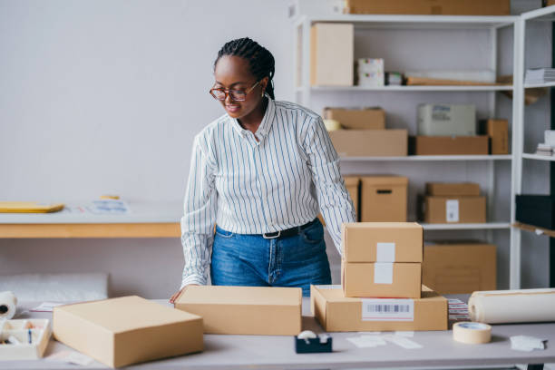 istock Woman Working In Packaging And Shipping Small Business Office Workspace 2189160035