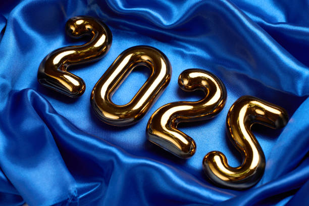 istock Happy New Year 2025 background with 2025 numbers on silk fabric texture 2189160371