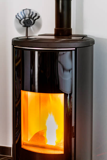 istock Pellet stove burning with flame in a living room 2189163040