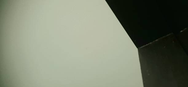 istock Black-brown door frame, cream-green wall background and white lighting. 2189163136