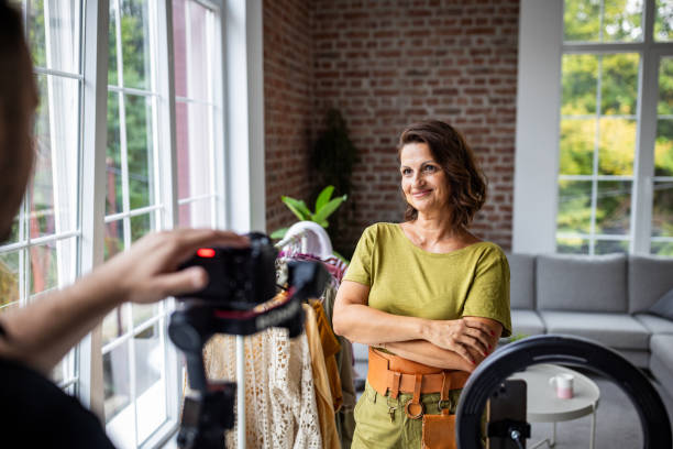 istock Woman with arms folded smiling in bright room 2189165546