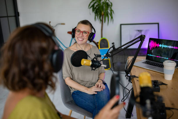 istock Two enthusiastic women creating a podcast together 2189165667