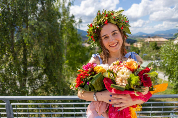 istock Smiling graduate with bunch of flowers on a balcony 2189166529