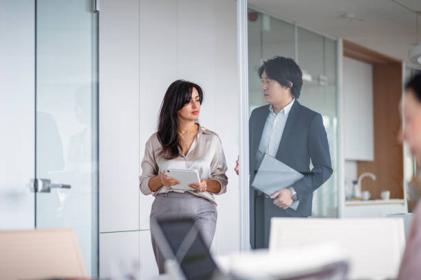 istock Business Professionals Discuss in Modern Office 2189170806