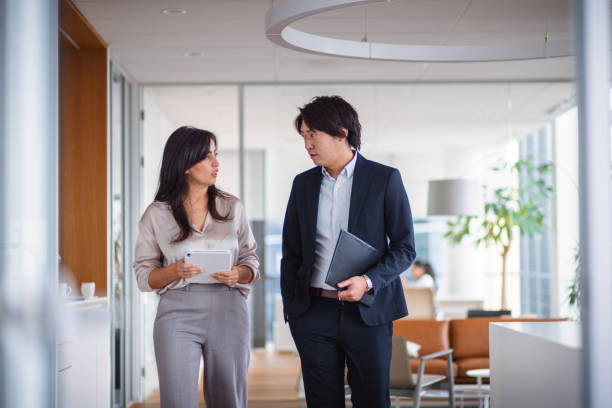 istock Business Colleagues Discuss Plans in Modern Office 2189170810
