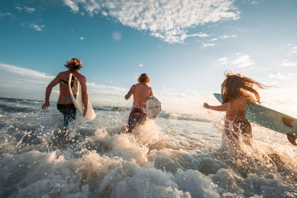 istock Enthusiastic Caucasian Surfers Embracing Sunrise Waves 2189171881