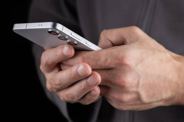 istock Close up of a man using mobile smart phone 2189173315