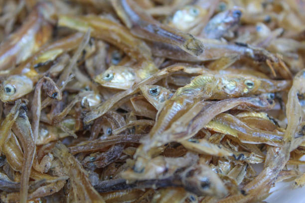 Asian style dried fishes sales on Asian street food market stall.Phuket Island - Thailand.
