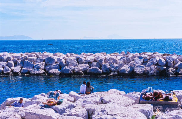 Italy, Napoli - Bay of Mergellina (04/06/2023) - People on the beach at via Caracciolo