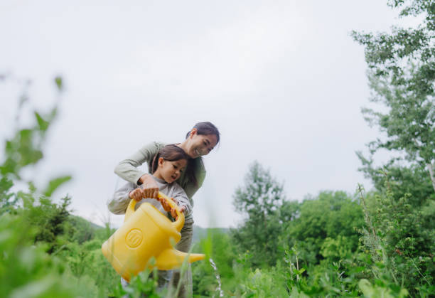 Mother and daughter gardening together