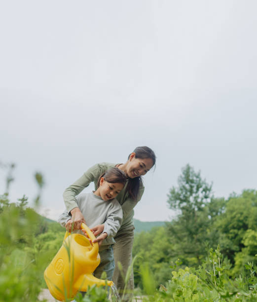 istock Mother and daughter gardening together 2189177363