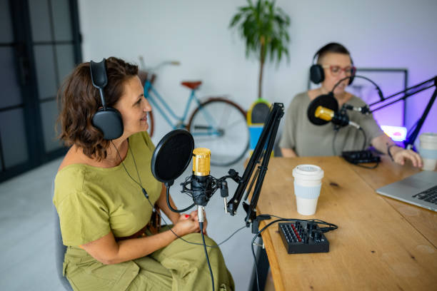 istock Friendly podcast hosts enjoying their recording time 2189177846