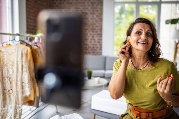 istock Happy Woman Showcasing Jewelry in Bright Setting 2189178245