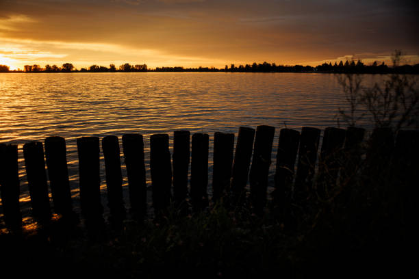 Cloudy sunset over Mincio river in Mantua, Italy