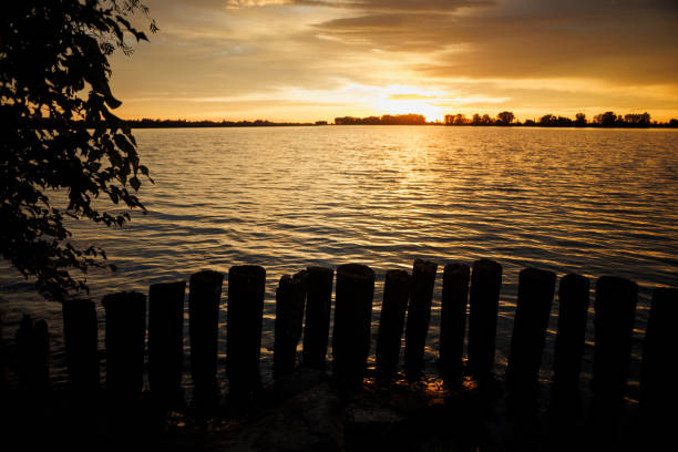 Cloudy sunset over Mincio river in Mantua, Italy