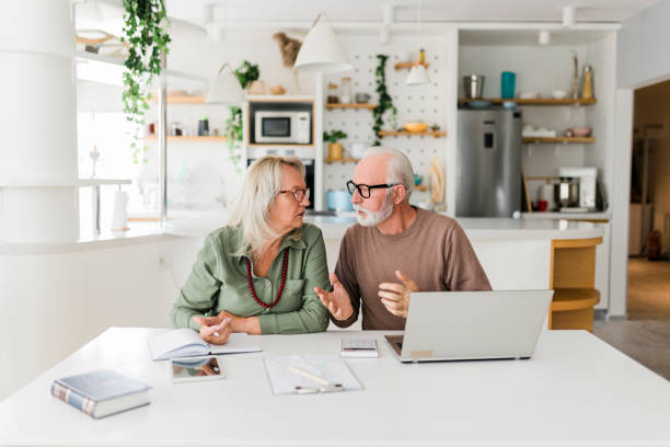 istock Senior couple using laptop while planning their home budget, 2189178673
