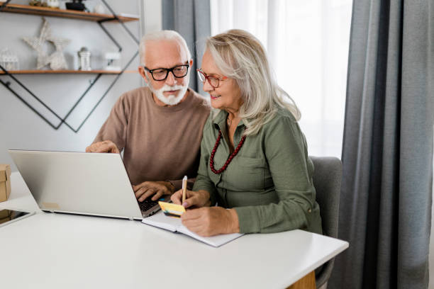 istock Senior couple shopping at home 2189180733