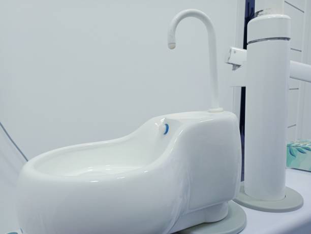 istock Special ceramic sink for spitting out white collyrium in a dental office. 2189182736