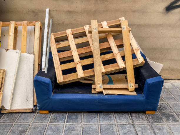istock Weathered blue couch with industrial pallet on it 2189183331