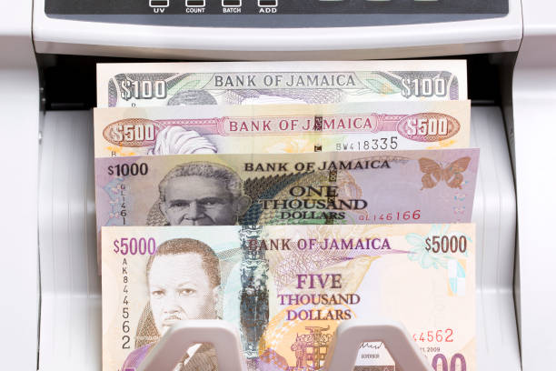 istock Jamaican dollar in the counting machine 2189184916