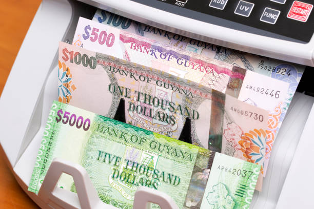istock Guyanese dollar in the counting machine 2189184977