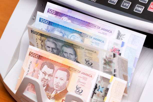 istock Jamaican dollar in the counting machine 2189185032