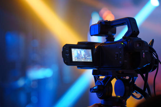 istock A professional videographer is filming a banquet hall event. 2189186782