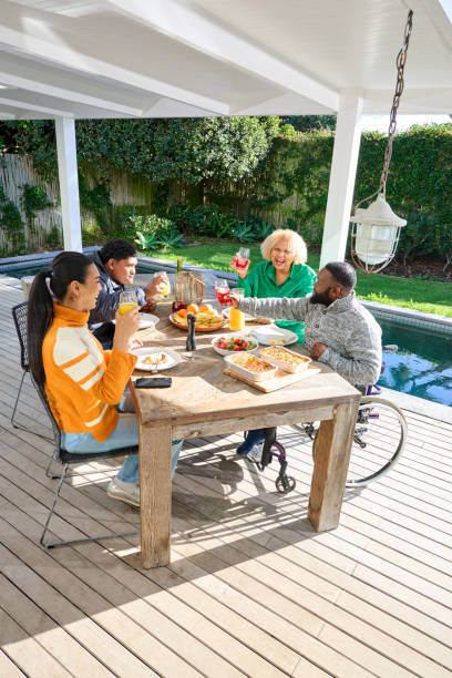 istock Friends at table on patio 2189187715