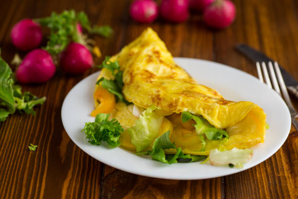 istock egg roll with sweet pepper and salad, on a wooden table 2189188084