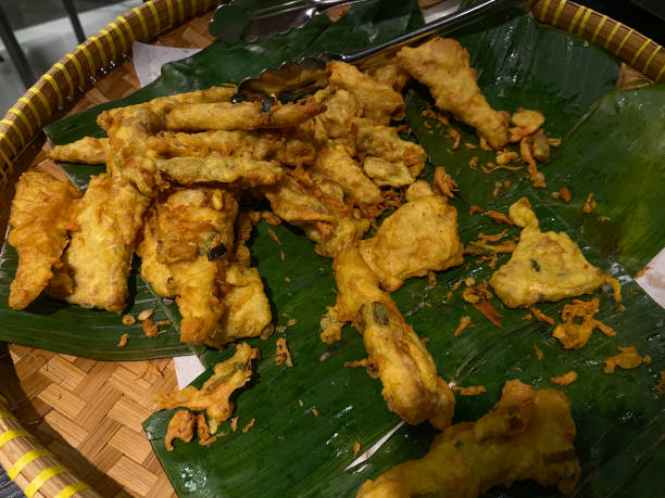 istock Tempeh fried with dough called mendoan, on banana leaves mat 2189188802