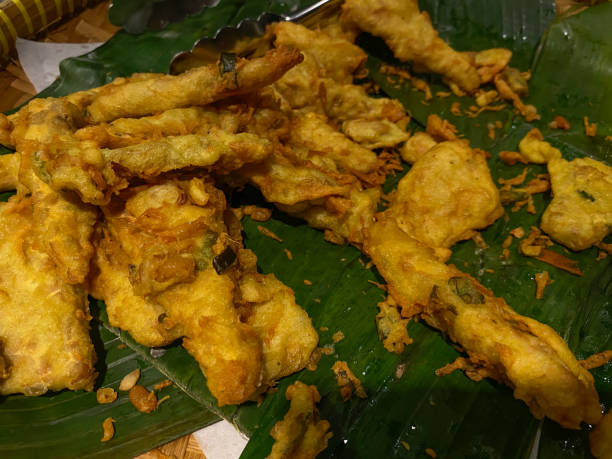 istock Tempeh fried with dough called mendoan, on banana leaves mat 2189188890