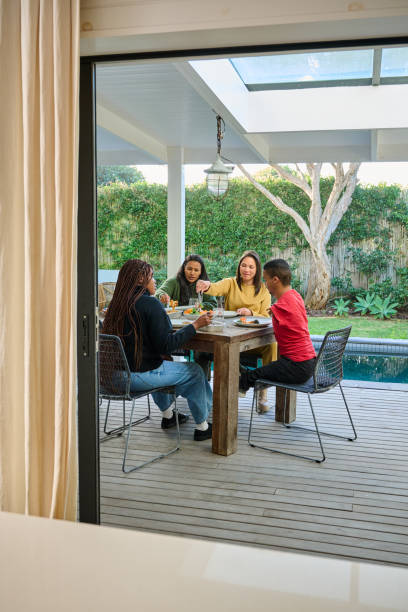istock Friends enjoying meal on patio 2189189671