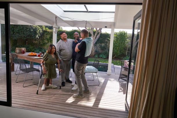 istock Smiling friends relaxing on patio 2189189788