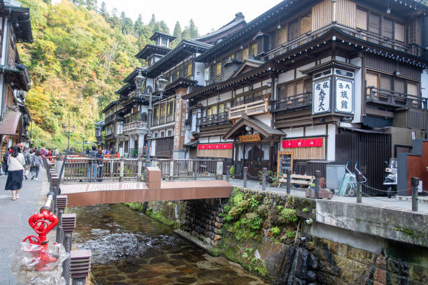 Ginzan onsen, Yamagata, Japan , Charming traditional buildings by a tranquil stream.