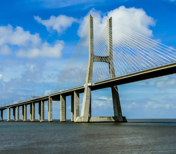 istock A large bridge spans a body of water, with a clear blue sky above 2189190867
