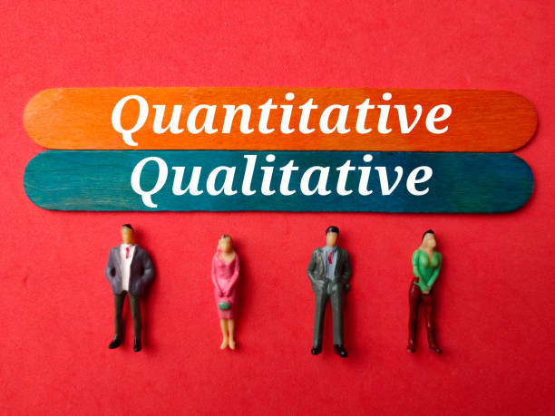 istock Miniature people with the word quantitative and qualitative on a red background 2189193009