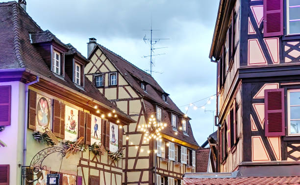 istock Charming half-timbered gingerbread houses adorned with decorations in a quaint village during festive season, Colmar, Alsace, France 2189195494