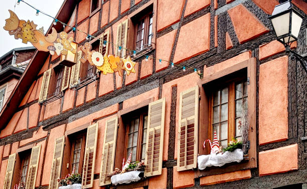 istock Charming half-timbered gingerbread house adorned with decorations in a quaint village during festive season, Ribeauville, Alsace, France 2189195510