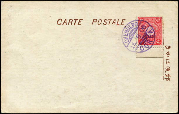Vintage blank Imperial Japanese postcard background sent from Japanese occupied Chemulpo (Now Incheon) of Korea in early 1900s, with Japanese stamps stuck on, a very good prop for any usage of mail delivering situation of that age. fondo de tarjeta postal imperial japonesa en blanco vintage enviado desde chemulpo ocupado por los japoneses (ahora incheon) de corea a principios de 1900, con sellos japoneses pegados, un muy buen accesorio para cualquier uso de la situación de entrega d