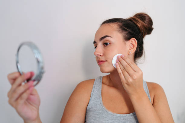 istock Young woman doing her beauty care routine 2189196132