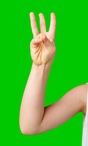 istock A hand showing the number three against a bright green background 2189196177