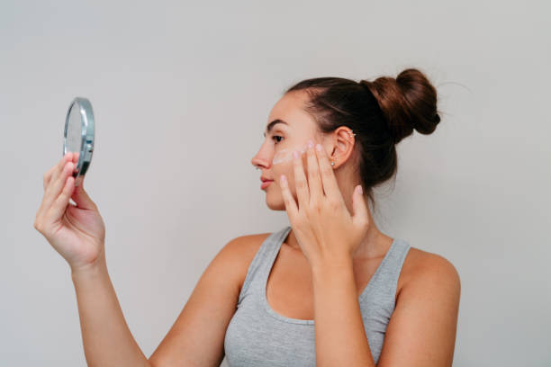 istock Young woman doing her beauty care routine 2189196183