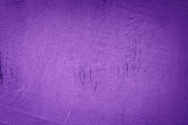 istock An old, textured wall with a grungy, vintage appearance, featuring a cracked surface in  dark purple tone 2189197890